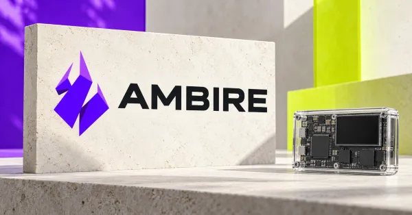 Large official purple Ambire unicorn emblem and black AMBIRE wordmark on an ivory sign beside an unbranded greyscale circuit board in a transparent case, against purple and lime panels.