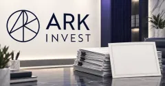 Large official navy ARK Invest logo on a light wall beside a greyscale stack of unbranded venture fund documents and a blank share certificate.