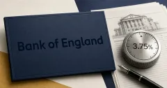 Official Bank of England wordmark, large and unobstructed on a navy policy-document cover, beside a greyscale 3.75% interest-rate dial, minutes papers and a fountain pen.