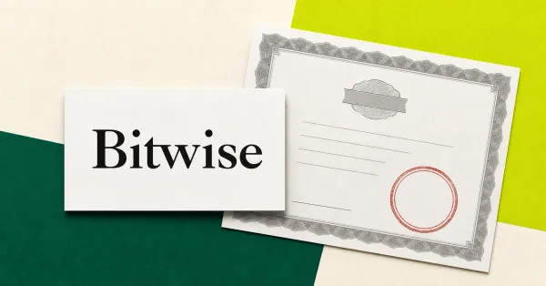 The official Bitwise wordmark on a large white placard beside a greyscale ETF redemption document with a red circular seal.