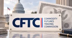 Large official navy CFTC wordmark on a white plaque in front of an unbranded greyscale Treasury-style certificate and the U.S. Capitol.