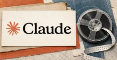 Large official Claude orange starburst and black wordmark on an ivory archival card beside an unbranded greyscale computer tape reel and punched paper strip, with terracotta and steel-blue panels.