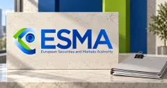 Large official blue and green ESMA logo on an off-white stone sign beside an unbranded greyscale document folder with a metal clip, against blue and lime panels.