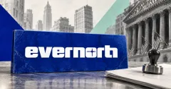 Large official white Evernorth wordmark on a cobalt-blue stone desk placard beside an unbranded greyscale shareholder voting document and approval stamp, with mint panels and financial architecture behind.