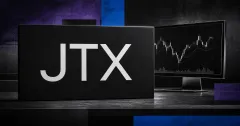Large official JTX wordmark on a black trading-desk surface beside a greyscale market monitor, set against violet and electric-blue editorial panels.