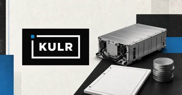 Large official KULR white wordmark inside its black bordered plaque with a blue accent, beside a greyscale industrial battery module, blank filing document and unmarked metal coins.