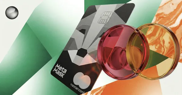MetaMask-branded Mastercard crypto card with overlapping red and gold payment circles, representing crypto payments, digital wallets, and blockchain-powered spending