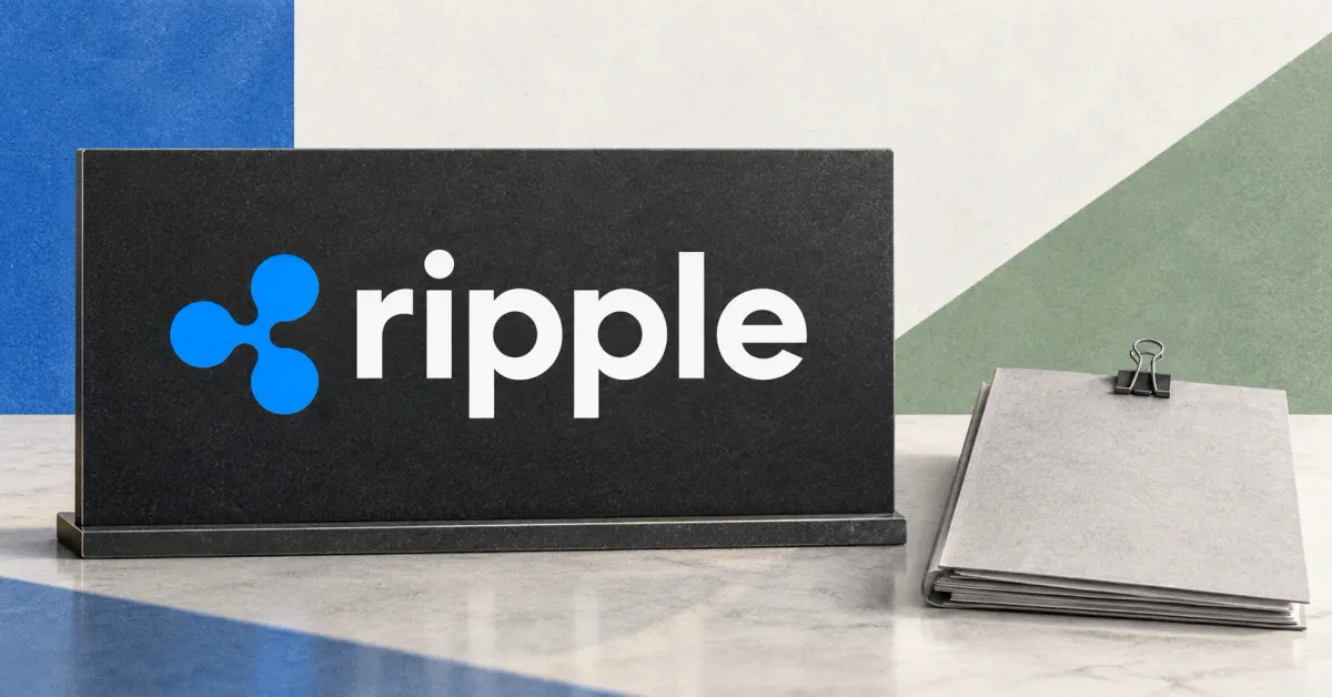 Large official blue Ripple emblem and white lowercase ripple wordmark on a charcoal desk sign beside an unbranded greyscale settlement-document folder and steel binder clip, against cobalt and sage panels.