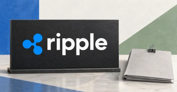 Large official blue Ripple emblem and white lowercase ripple wordmark on a charcoal desk sign beside an unbranded greyscale settlement-document folder and steel binder clip, against cobalt and sage panels.
