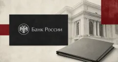 Large official Bank of Russia logo on a charcoal plaque beside a blank greyscale legal document folder and a classical central-bank facade on an off-white and dark-red editorial background.