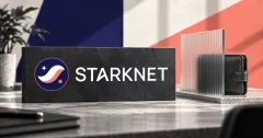 Large official navy, coral and white Starknet emblem and white STARKNET wordmark on a charcoal stone sign beside an unbranded greyscale leather wallet behind a frosted glass privacy screen, against off-white, navy and coral panels.