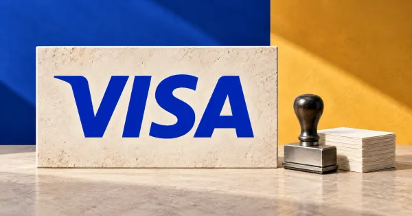 One large official blue VISA wordmark on an upright pale limestone sign beside a smaller unbranded greyscale bank stamp and blank payout slips, against cobalt and ochre panels.