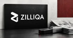 Large official white Zilliqa wordmark and angular mark on a charcoal plaque beside a greyscale unbranded hardware wallet, anonymous transaction papers and a red alert light.